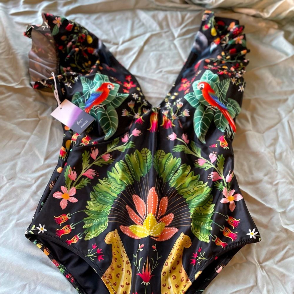 Brand new, tag on. Averie ruffle top one piece swimsuit. Full coverage